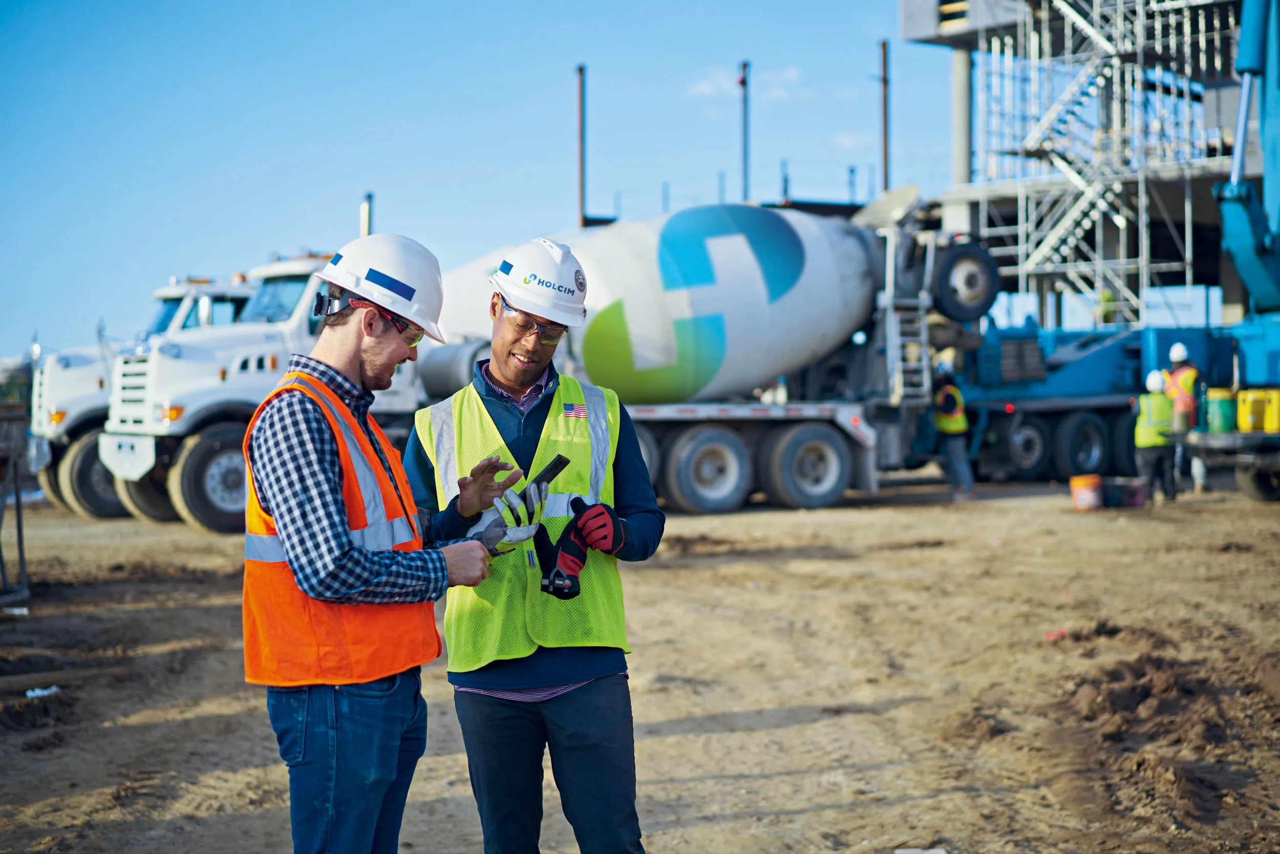 Two men at construction site with concretedirect app