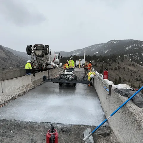 pouring concrete for construction of the bridge